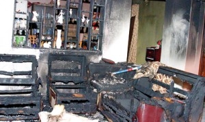 Charred remains: The sitting room area of the house. Pix by Indika Handuwala