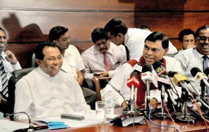 The two news conferences held yesterday: One convened by the Govt. and the other by FUTA. Pix by Mangala Weerasekera