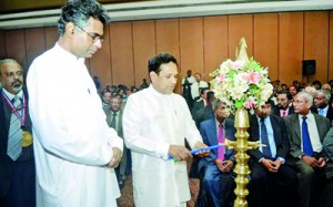 Guests of Honor, Hon Patali Champika Ranawaka and Hon Dr Rajitha Senaratne lighting the oil lamp