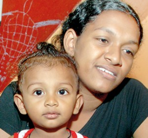 Thushari and baby, victim Madushanka’s wife.  Pix by M.D. Nissanka and M.A. Pushpa Kumara