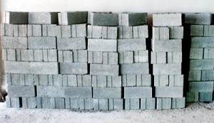 Concrete blocks (above) and bags of cement (below): At a high price