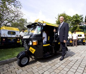 Seen here German Ambassador Jrgen Morhard with the fleet of new gas three-wheelers.