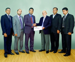 Seen above are (from left) - S. Gnanam, Head of Sales and Marketing of Tech Pacific Lanka (Pvt) Ltd; Hafez Wahid, Managing Director of Tech Pacific Lanka (Pvt) Ltd; Yusuf Shiraz, Sri Lanka Country Manager for Lenovo; M.D.H. Wahid, Chairman of Tech Pacific Lanka (Pvt) Ltd); and two other team members.