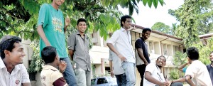 Back to university after three months: Kelaniya students share a light moment. Pix by Mangala Weerasekera