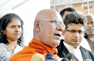 Ven. Omalpe Sobitha Thera and WPC Minister Udaya Gammanpila outside Court. Right: NLSSP Leader Wickramabahu Karunaratne and former CMC member Azath Salley. Pix by  Susantha Liyanawatte