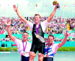Drysdale stands triumphant on the medal podium in London. Reuters.