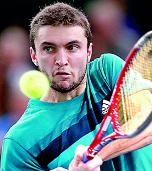 Simon survives, Tsonga upset at Paris Masters