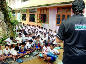 Carlos with children at a workshop