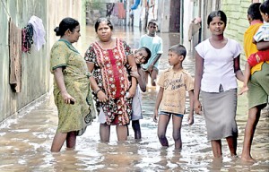 Scenes of flooding and devastation pour in from across the country. More than 15,000 peope have moved to temporary shelters. Photos: Indika Handuwala and Mangala Weerasekera