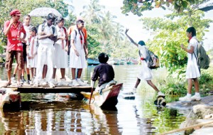 A hop, skip, and a jump: School children take the convenient early morning canoe ferry