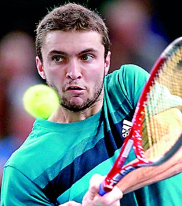 Gilles Simon of France returns the ball during his quarter-final match against Tomas Berdych. Reuters.