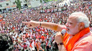 Gujarat's CM Modi addresses his supporters during an election rally (Reuters)