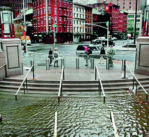 Water fills the Bowling Green subway station in Battery Park,New York (AFP)