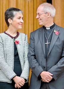 The new Archbishop of Canterbury Justin Welby (R) poses for pictures with his wife Caroline (AFP)