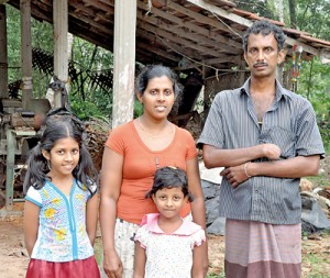Blow after blow: Nandana with his wife and children. Pic by Ranjith Perera