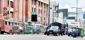 Chaos or order: No police officers at the busy Borella junction. Pix by Mangala Weerasekera