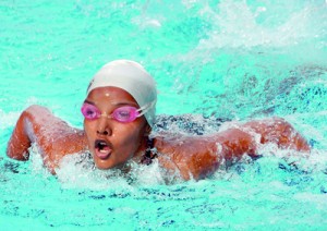 Leaving it all in the pool: A young female swimmer forges on determinedly in her event at the Inter-International Swimming Championships, which saw Lyceum International School Wattala take the lead with a tally of 505 points, after action at the Sugathadasa Indoor Stadium pool yesterday. The competition will draw to a close today, with several exciting finals scheduled to be worked off. Pic by Amila Gamage