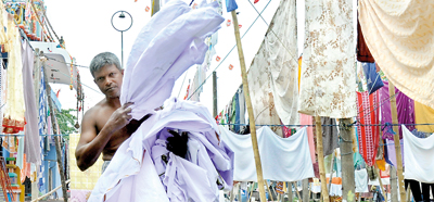 Generations-old laundry workers may be  squeezed dry by  modernisation