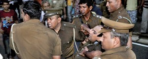 The STF Commandant being rushed for emergency medical attention after being shot in the abdomen