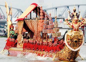 Thai oarsmen row a royal barge during the Royal Barge Procession, at the end of Buddhist ceremonies on the Chao Phraya River in Bangkok (REUTERS)