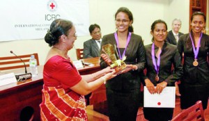 The Vice Chancellor of the University of Colombo Professor Kshanika Hirimburegama giving away the Championship trophy to APIIT National Champions.— at Senate Room, College House, University of Colombo.