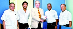 MCC Member Tom Seabrook presents Kushil Gunasekera with his invitation to HLM of MCC