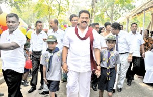 President Rajapaksa being received by the organisers of the healthy food exhibition at the Viharamahadevi Park yesterday. Pic by Gayan Amerasekera