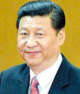 Get used to this face: Xi's inaugural address as the country's new leader was broadcast on giant screens across China. Here, above a McDonald's in Beijing