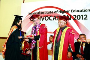 An MBA student being awarded the degree