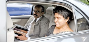 Chief Justice Shirani Bandaranayake pulled down the rear window to give a broad smile to journalists when she drove to Parliament on Friday for the hearing of the impeachment motion against her. Pic by Indika Handuwala