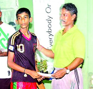 Most outstanding player in Vavunia District  A. Stanley ofV/ Sundarapuram G. T. M. S. receiving his award from Mr. J Mohan , Secretary , Jaffna District TT Association.