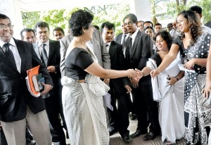 'Don't give up, keep it up' seems to be message from lawyers and the Supreme Court staff as Chief Justice Shirani Bandaranayake returned to her chambers in Hulftsdorp after she confidently faced an impeachment motion against her before the Parliamentary Select Committee on Friday.  Pic by Mangala Weerasekera