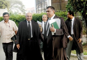 The Attorney General (second from left) with his team of lawyers