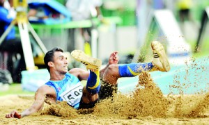 Over-20 Triple Jump winner D.M.E. Dinesha of Gampaha set a new meet record. - Pics by Amila Gamage.
