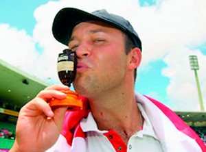 England cricketer Jonathan Trott kisses the Ashes