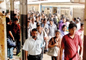 Disembarking passengers are hampered by  limited space and have to jostle each other