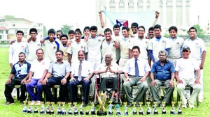 The victorious Gateway U-17 cricket team with their chairman, R.I T Alles and other officials.