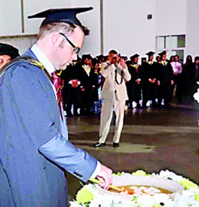 Mr. Owain Llwyd, the senior International Marketing Officer - Cardiff Metropolitan University – UK, lighting the traditional oil lamp