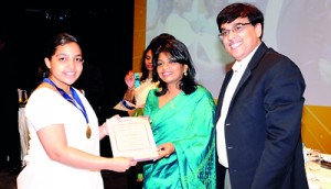 Sanduni Jayasooriya from Ladies College receiving the world prize for GCE A/L Accounting from Ms. Premila Paulraj - Asst. Vice President of Pearson Edexcel – India  Subcontinent  and Mr. Ranu Kawtra