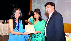 Ayu Asmara Fitri from Stafford International School receiving the world prizes for GCE A/L Accounting and Business Studies from Ms. Premila Paulraj - Asst. Vice President of Pearson Edexcel – India  Subcontinent  and Mr. Ranu Kawtra