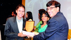 Minuri Yasara Dharmasena from Gateway College Kandy receiving the Best International GCSE Results Award obtaining 12 A*s at the June 2011 and June 2012 exam sessions, from Mr. Ranu Kawatra - CEO & President of Pearson Education