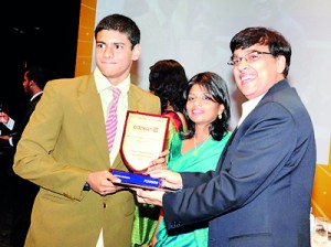 Adnan Jafferjee from Colombo International School receiving Best International GCSE Award obtaining 9 A*s at theResults  June 2012 exam session, from Mr. Ranu Kawatra - CEO & President of Pearson Education