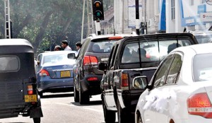 An accident waiting to happen. Pedestrians cross the  road through moving traffic.