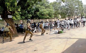 Police trying to disperse the protesting Jaffna University students.  Pic by D. Premnath.