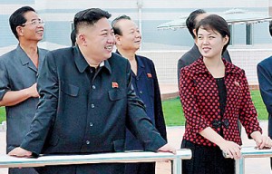 'Pyongyang-bred heartthrob': The article said Kim Jong Un's wife Ri Sol-Ju (right) was 'one lucky lady'