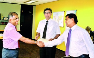 Seen here after signing the agreement; Chairman/ Director General of BOI, M.M.C. Ferdinando, with Sharad Amalean - Deputy  Chairman, MAS Holdings (centre) and Sudarshan Ahangama - Group Finance Director, MAS Holdings (right).