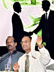 Jayampathy Wickramaratne,PC,waves a copy of the 2000 draft constitution, seated next to law academic V.Thamilmaran,during a discussion on the impeachment in Colombo.(Above) pix of the President, Speaker, Chief Justice and  members of the Select Committee. Pic by Amila Gamage