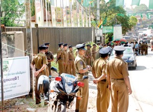 As thousands of delegates gathered for the UNP's crisis-ridden convention yesterday, party headquarters Sirikotha was like a fortress with hundreds of armed security forces personnel guarding the vast area around it. Pic by M.D. Nissanka