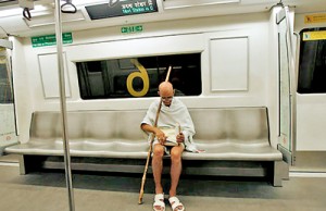 Mahesh Chaturvedi, reads a copy of the Bhagavad-Gita, on a metro train in New Delhi (REUTERS)