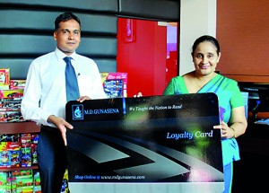 Mr. Rajiv Gunasena, Deputy Managing Director - M. D. Gunasena handing over the Loyalty Member Card to Mrs. Sandamali Aviruppola Principal Visakha Vidyala Colombo